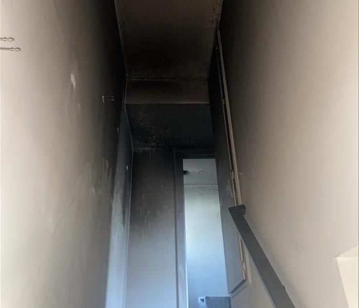 Soot covered hallway.